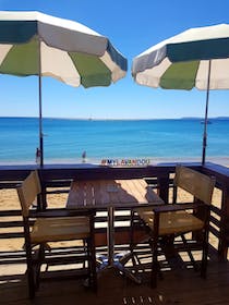 Enjoy the view over lunch at Plage restaurant L'Effet Mer