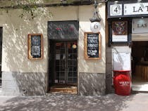 Enter cosy tavern in the Literary Quarter at Vermú