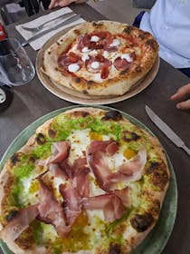 Dine on pizza at La Finestra Sul Cielo Ristorante Pizzeria