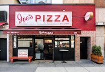 Grab a slice of New York's famous pizza at Joe's Pizza