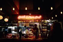 Sip signature cocktails with a view of the skyline at Suramare