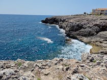 Explore Cala Morlanda's Crystal Clear Waters and Snorkelling Opportunities