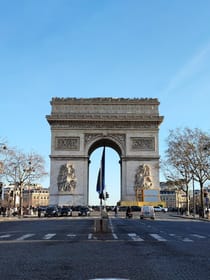 Admire the iconic Arc de Triomphe