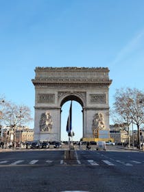 Admire the iconic Arc de Triomphe
