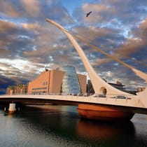 Admire the design of the Samuel Beckett Bridge