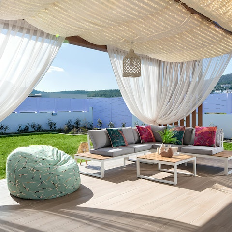 Unwind with a glass of wine in the outdoor seating area