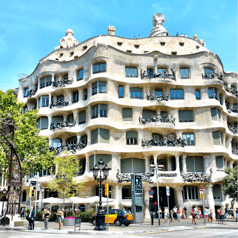Admire the beauty of La Pedrera-Casa Milà, reachable on foot