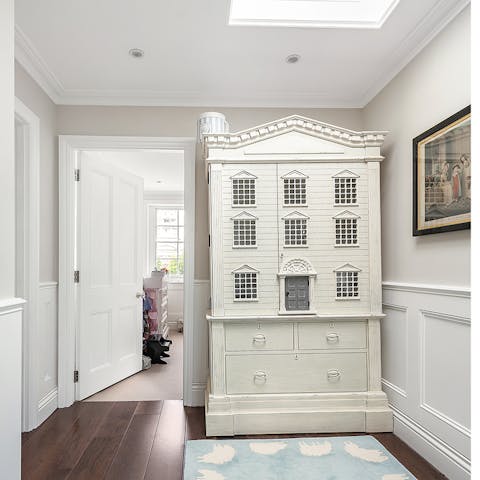 Admire the doll's house, it's almost as grand as the real thing