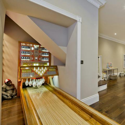 Have a game on the 1950s-style bowling alley
