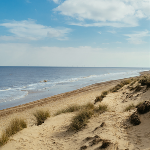 Drive twenty minutes to the Norfolk coast and breathe in the salty sea air