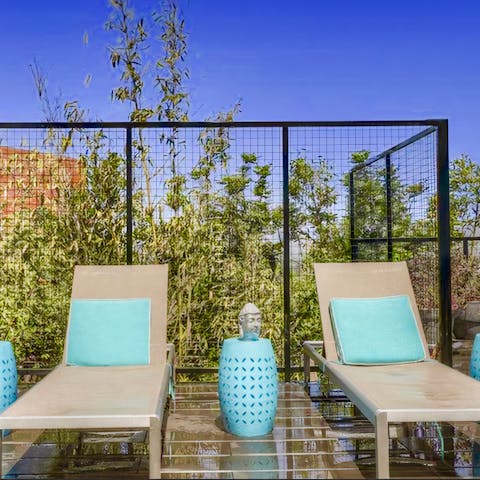 Lie back and relax on a lounger and soak up the sunshine