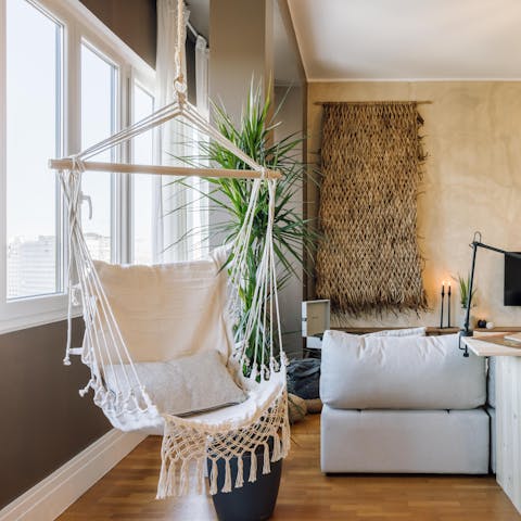 Chill out in the living room's hanging chair while a record plays on the turntable