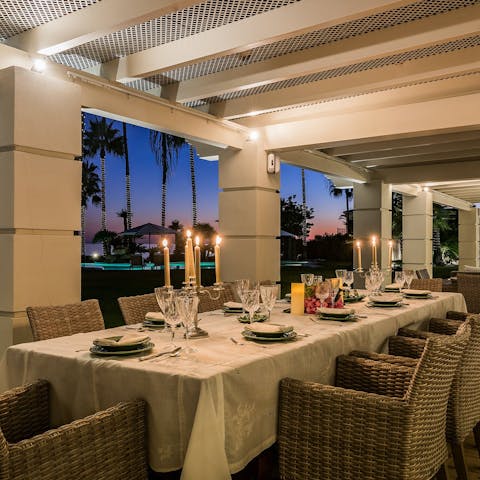 Enjoy a sunset meal at the covered terrace dining area