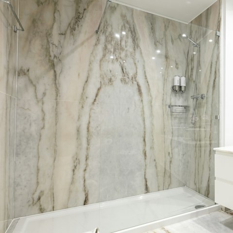 Start mornings off with a relaxing soak in the stunning marble shower