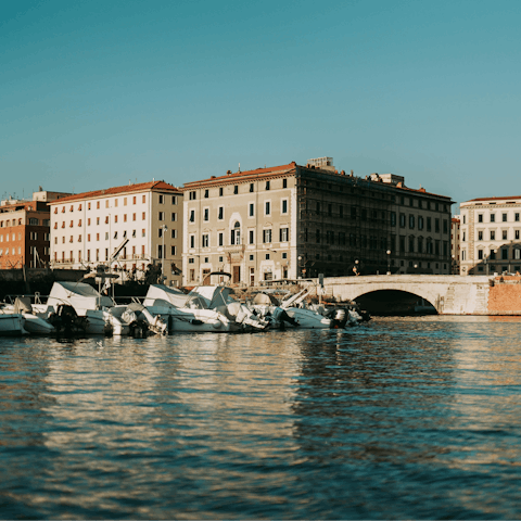 Wander the canals of Livorno, a short drive away