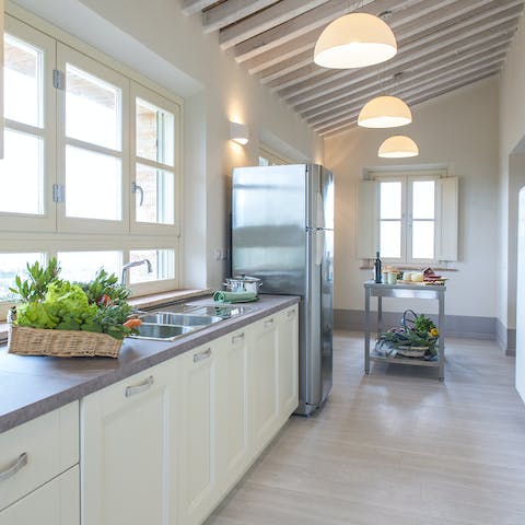 Cook up your favourite meals in the bright kitchen