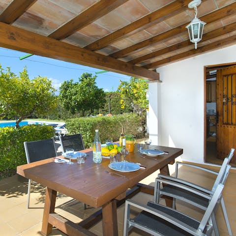 Tuck into a fresh breakfast of local produce under the shade of the pergola