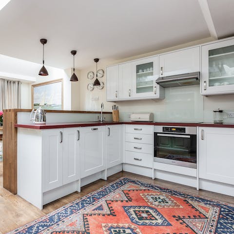 Cook a meal in the well appointed kitchen