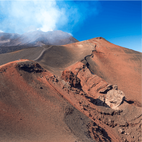 Stay on the slopes of Mount Etna and explore the surrounding national park