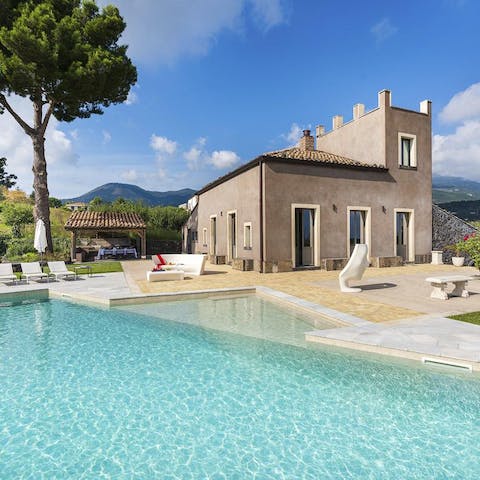 Take a refreshing dip in the glittering blue swimming pool