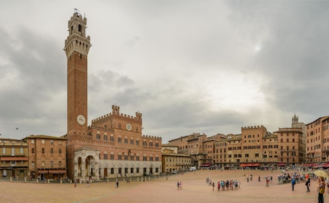 Discover the timeless elegance of a classic Tuscan arcaded town piazza