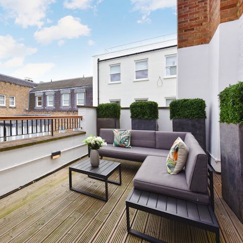 Sip a glass of wine on the private balcony