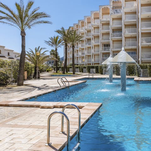 Enjoy refreshing dips in the communal pools