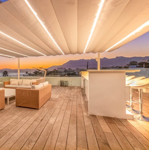 Pour yourself a sundowner on the terrace bar