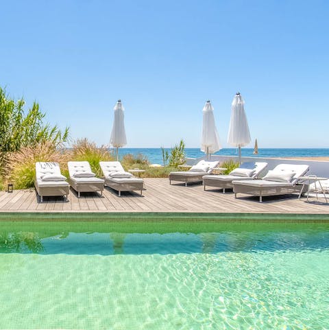 Lounge in the sun beside the pool