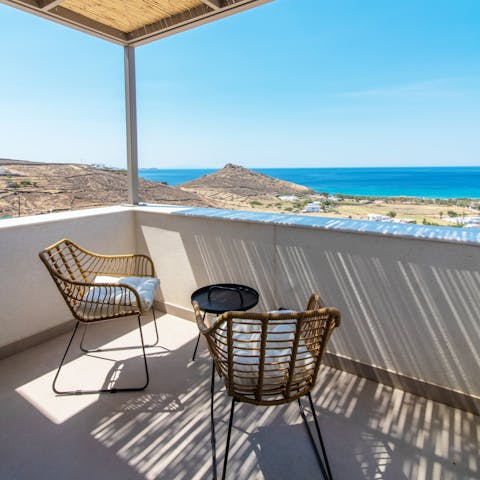 Watch a romantic sunset while toasting a happy holiday on the private balcony