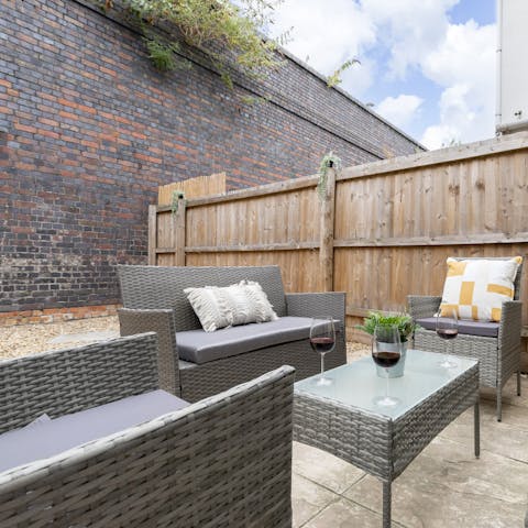 Enjoy a glass of wine in the courtyard garden