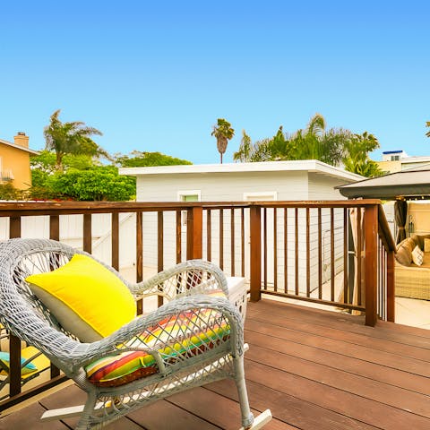 Relax on the deck in a wicker rocking chair