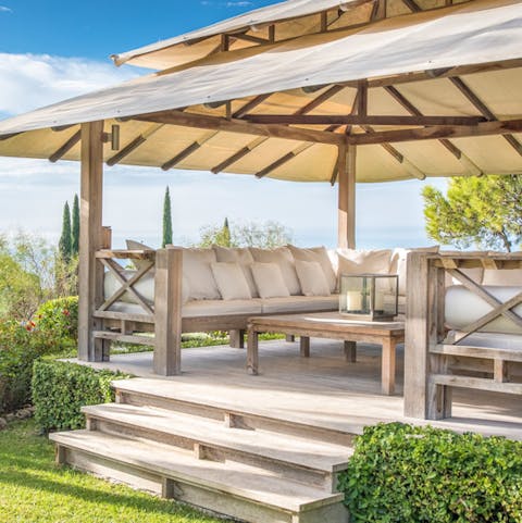 Share stories and a tipple with friends under the awning