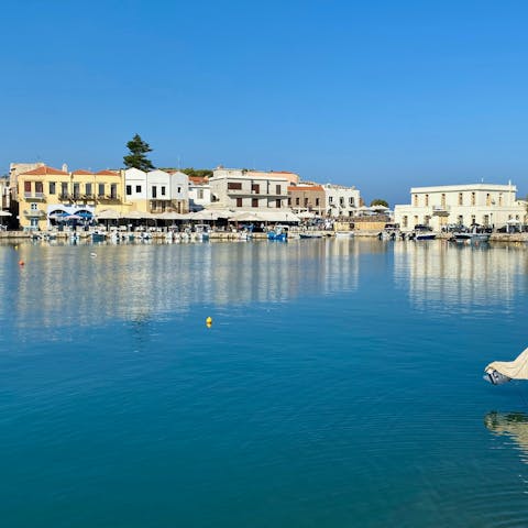 Stroll around the old harbour of Rethymno and find a friendly bar for an ouzo