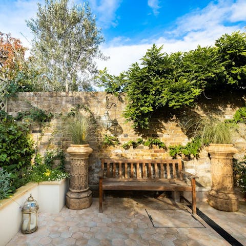Make the most of the sunshine and enjoy cocktails in the courtyard garden