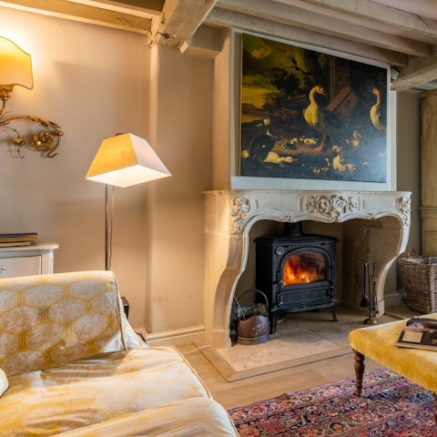 Relax by the wood-burning stove on a winter's evening