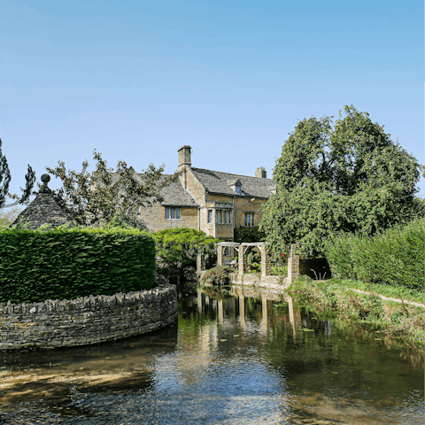 Visit the picturesque Bourton-on-the-Water, a seven-minute drive away