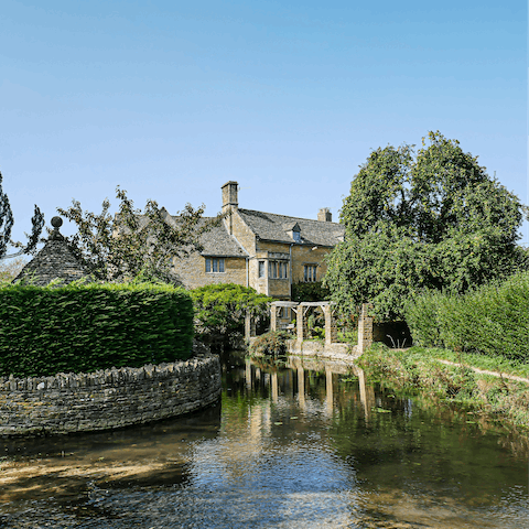 Visit the picturesque Bourton-on-the-Water, a seven-minute drive away