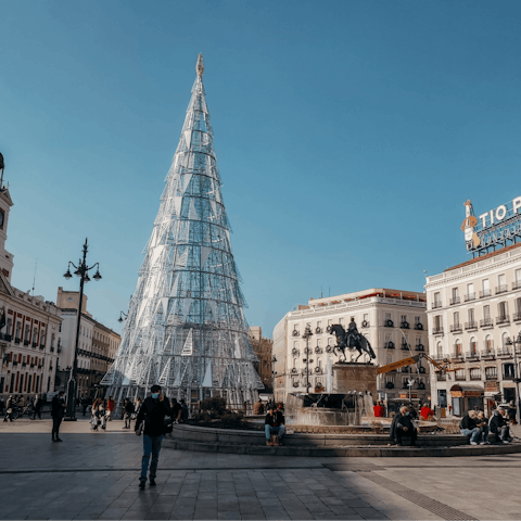 Do some people watching at the Puerta del Sol – easily accessible by metro