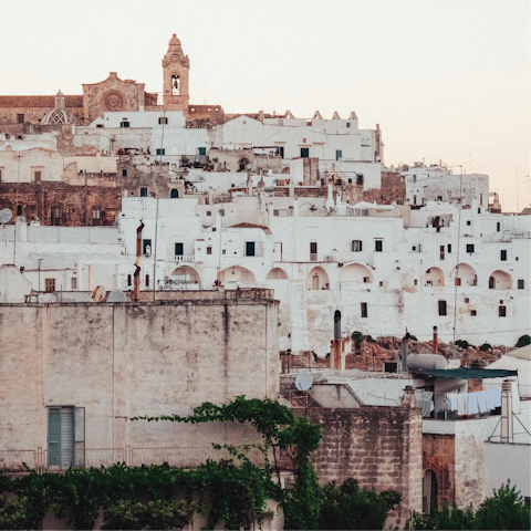 Explore nearby Ostuni with its narrow, winding streets