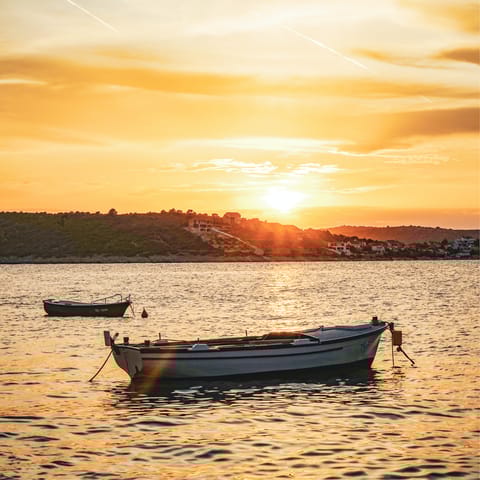 Stay in quiet coastal town of Sevid, where the locals grow grapes and olives