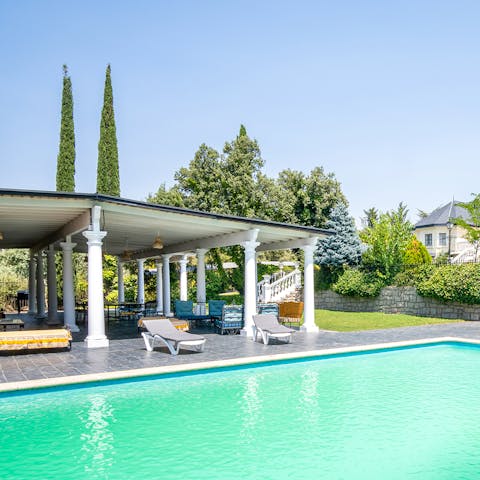 While away the hours in the pristine pool in your private garden