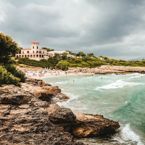 Dip your toes in the water at Alcúdia Beach, a short drive from home