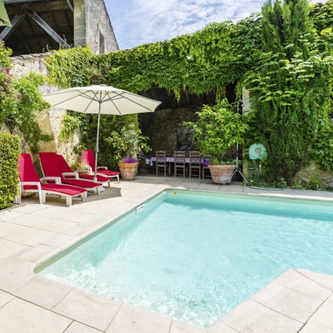Take refreshing dips in the pool or relax in the sun by its side