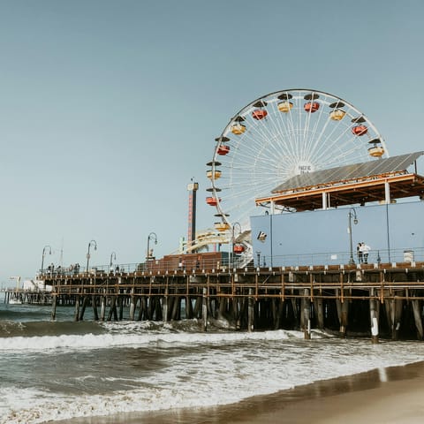Enjoy strolls along Santa Monica Pier – a short drive away