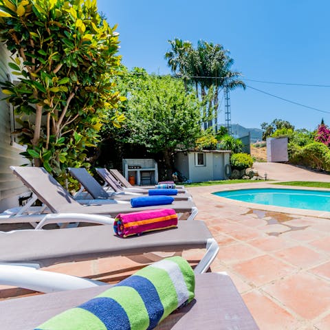 Savour a glass of Aperol Spritz by the outdoor pool