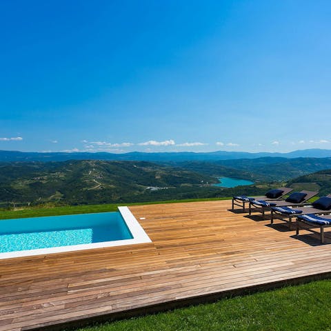 Feel on top of the world while lounging by the pool