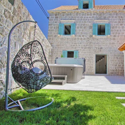 Get into a good book while relaxing in your swinging egg chair