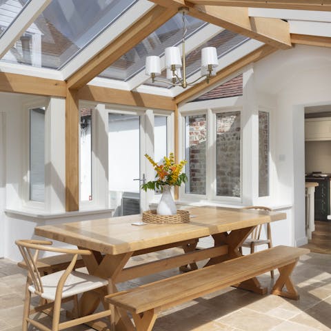 Enjoy a family meal in the sunny conservatory