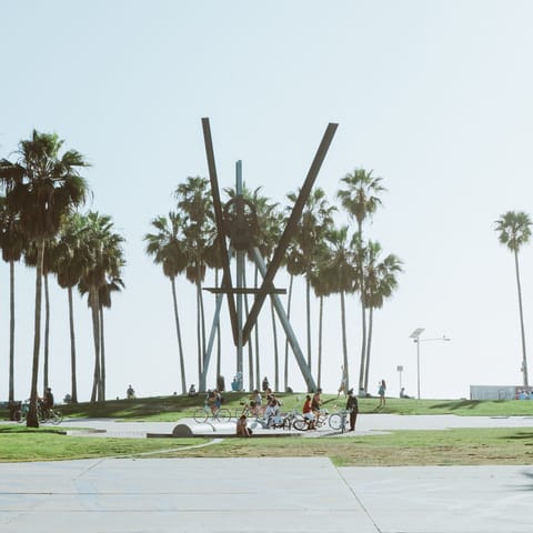 Ride your bike down Venice's lively boardwalk to Santa Monica – the pier is just a seven-minute ride away